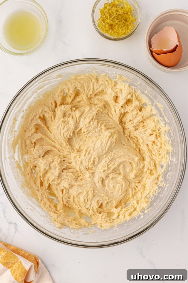 Overhead view of the smooth, thick lemon whoopie pie dough in a mixing bowl after all ingredients have been incorporated, showing a perfect consistency.