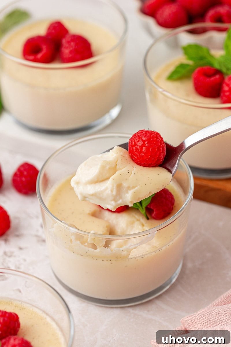 a spoonful of vanilla panna cotta showing the creamy texture