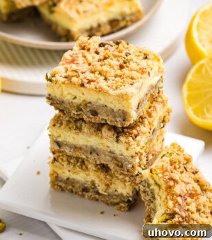 stack of lemon pistachio cheesecake bars