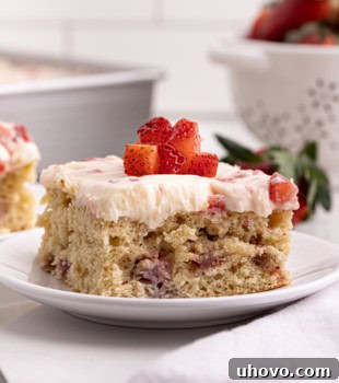 slice of strawberry sheet cake on a white plate
