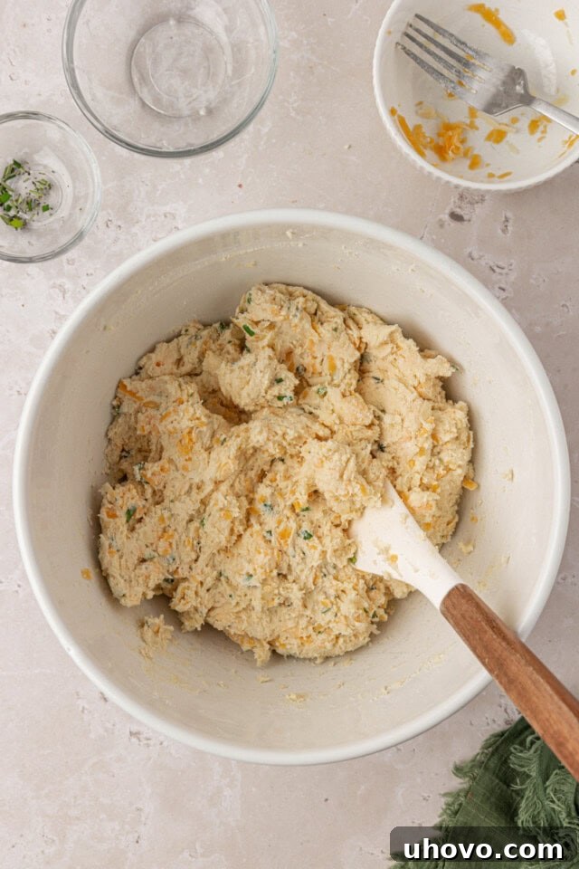 herb and cheese scone dough in a mixing bowl