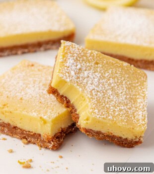Tangy Lemon Icebox Bars Recipe — Cool, Zesty Dessert with Shortbread Crust 14 two lemon icebox bars with graham cracker crust