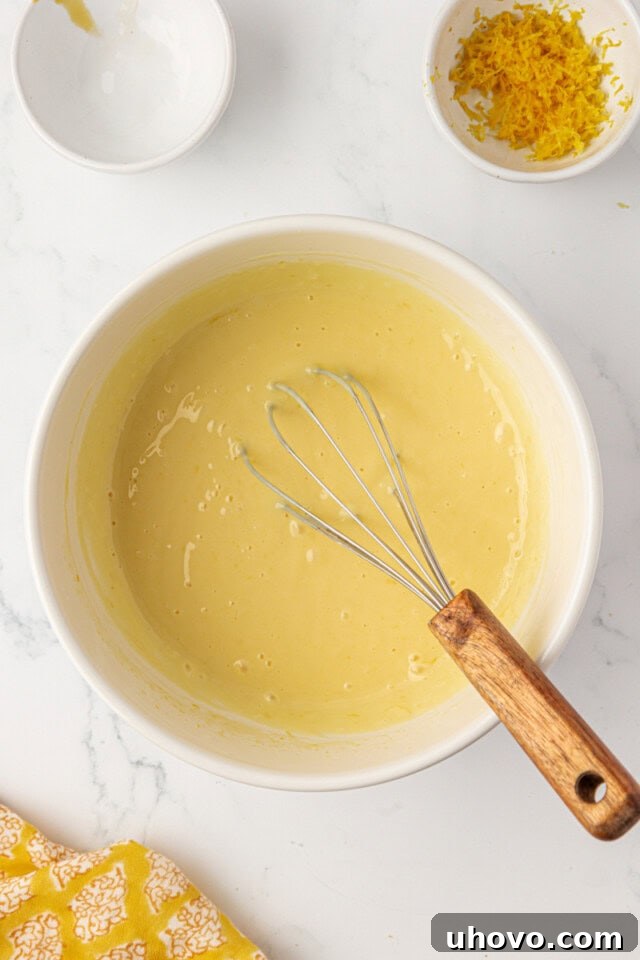 Tangy Lemon Icebox Bars Recipe — Cool, Zesty Dessert with Shortbread Crust 5 overhead view of lemon icebox bar filling mixture in a bowl