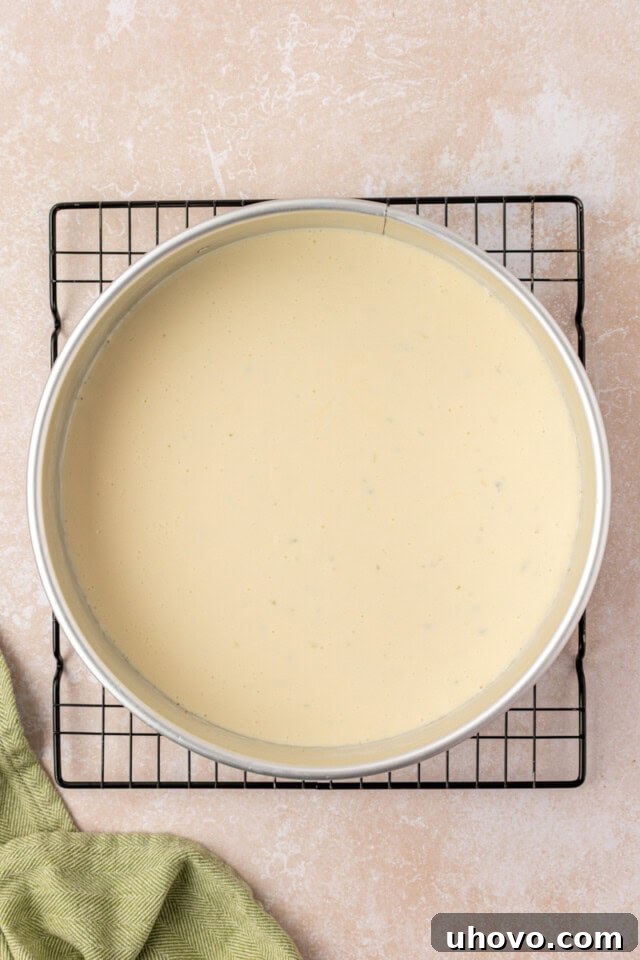 Creamy Key Lime Cheesecake Recipe: Zesty No-Bake Dessert 5 overhead view of Key lime cheesecake in a springform pan before baking