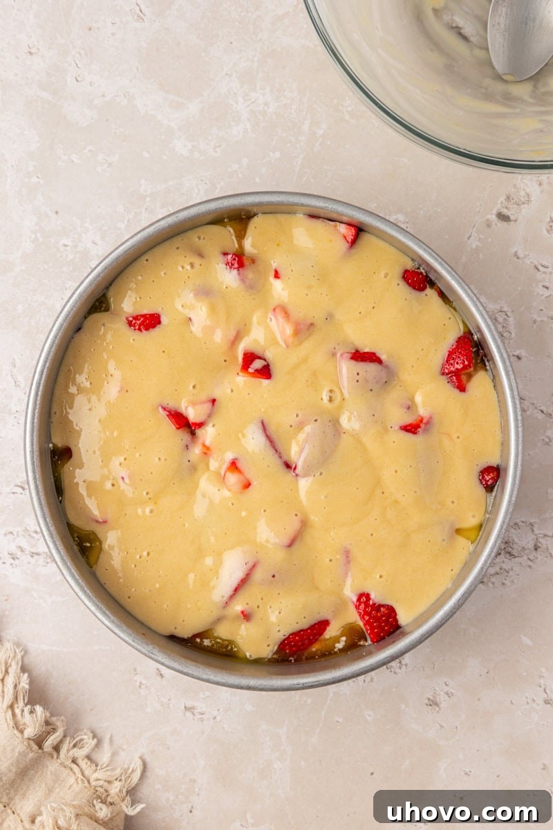 Strawberry Spoon Cake Recipe: Quick No-Bake Dessert for Summer 5 overhead view of strawberry spoon cake in a cake pan ready to go into the oven