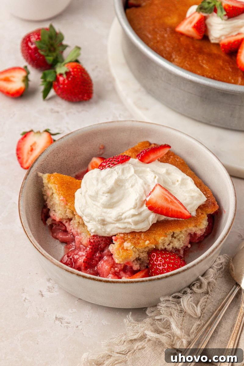 Strawberry Spoon Cake Recipe: Quick No-Bake Dessert for Summer 7 a bowl of strawberry spoon cake topped with whipped cream and fresh strawberries
