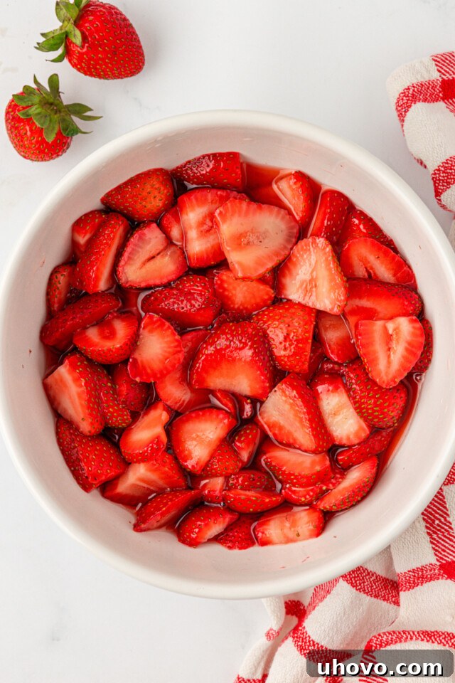 Mini Strawberry Shortcake Jars Recipe 6 macerated strawberries in a white bowl
