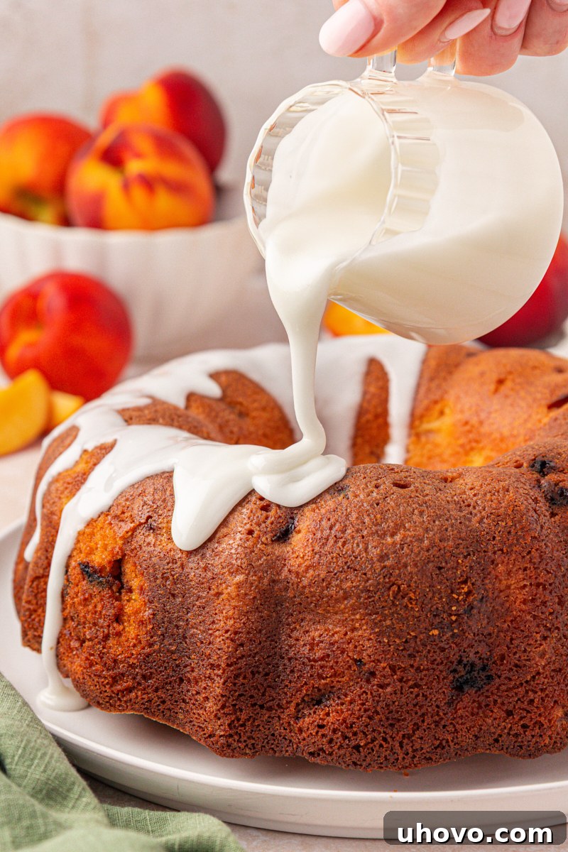 Peach Pound Cake Recipe with Fresh Peaches 8 almond glaze pouring over peach pound cake
