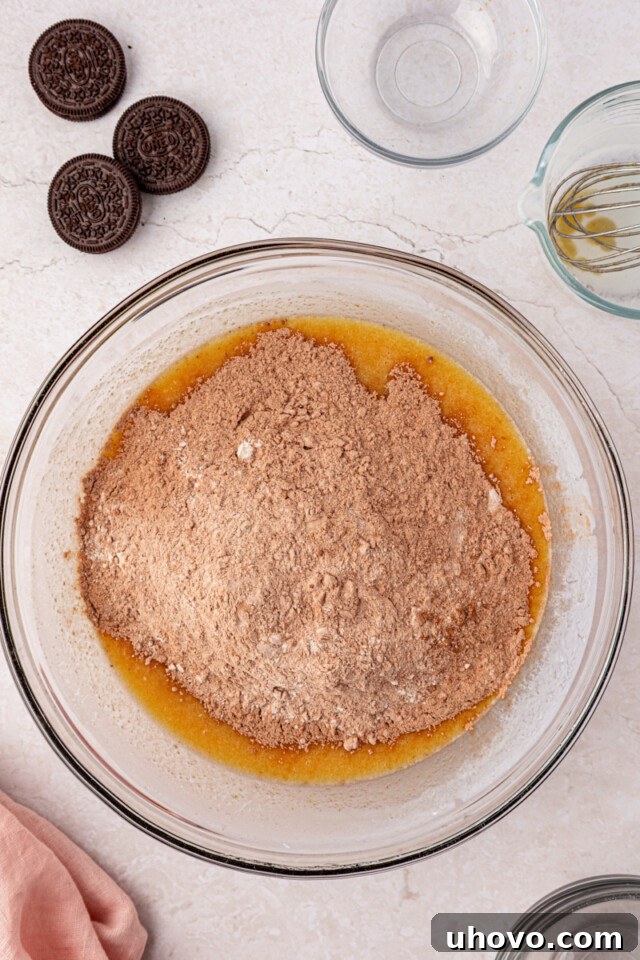 Decadent Oreo Sheet Cake with Creamy Oreo Frosting 4 dry ingredients added to wet ingredients for chocolate cake