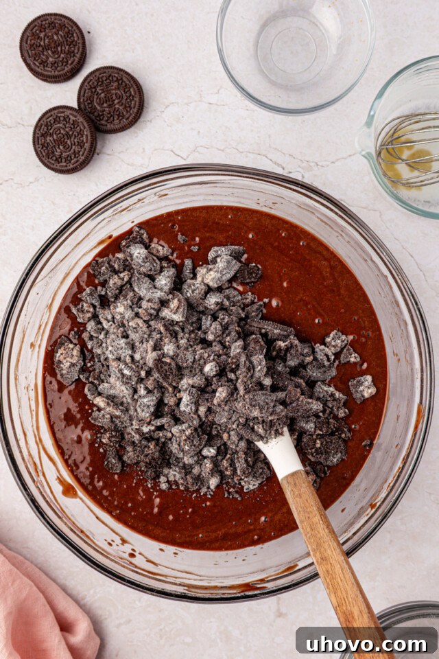 Decadent Oreo Sheet Cake with Creamy Oreo Frosting 6 chopped Oreo cookies added to chocolate cake batter