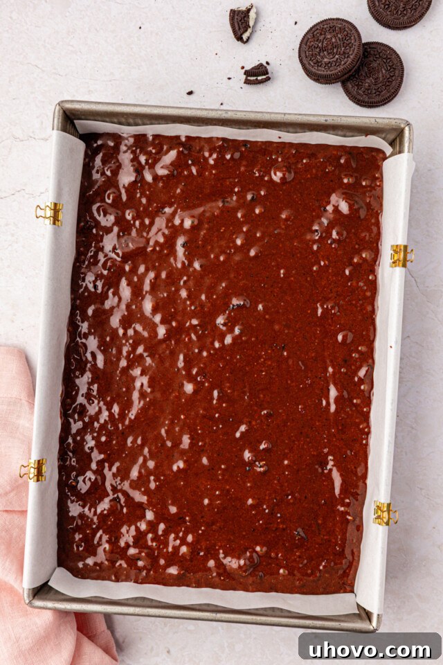 Decadent Oreo Sheet Cake with Creamy Oreo Frosting 7 chocolate Oreo cake batter in a 9x13 pan before going into the oven