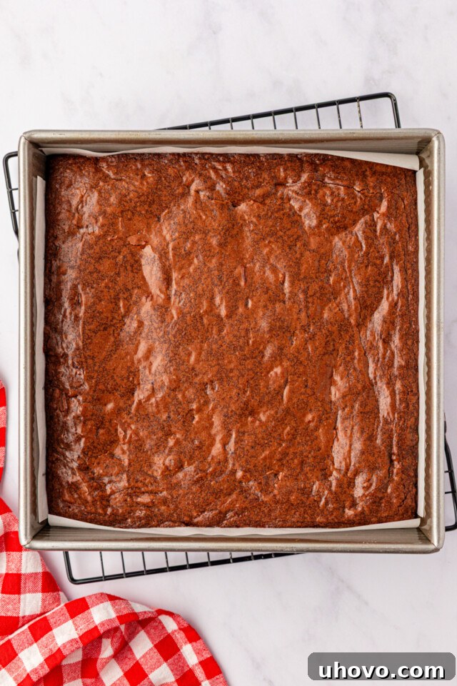 freshly baked brownies in a square metal baking pan