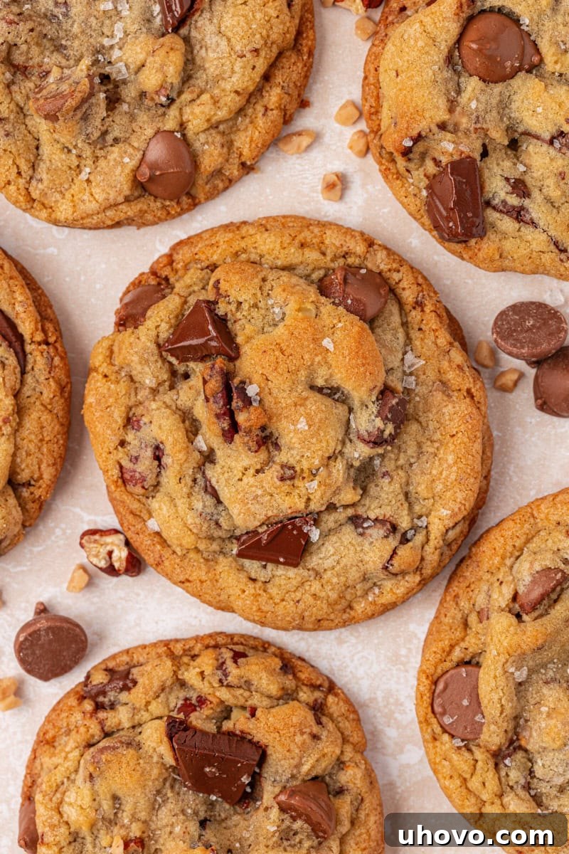 Gooey Loaded Chocolate Chip Cookies 10 close-up of chocolate chip cookies loaded with two kinds of chocolate, toasted nuts, and toffee bits