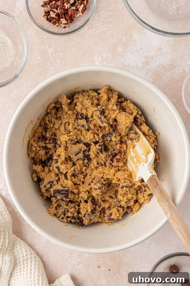 Gooey Loaded Chocolate Chip Cookies 6 overhead view of loaded chocolate chip cookie dough in a mixing bowl
