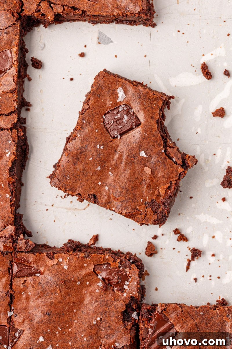 overhead view of a fudgy brownie with a bite missing