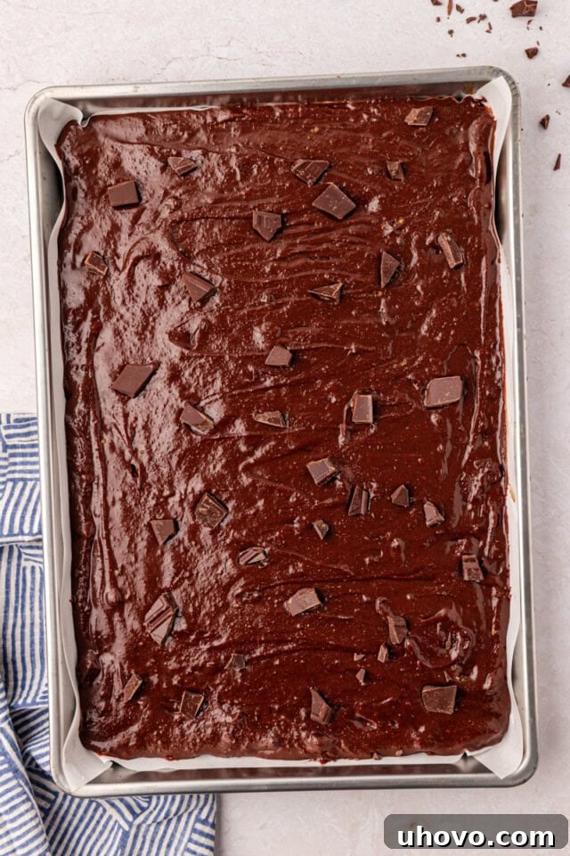 brownie batter spread in a sheet pan before baking