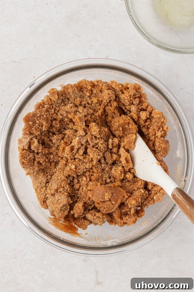 cinnamon streusel mixture in a glass mixing bowl