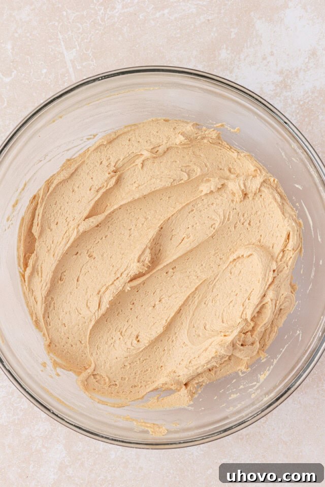 Decadent Chocolate Peanut Butter Cupcakes 7 peanut butter frosting in a mixing bowl