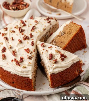 partially sliced maple snack cake with maple buttercream frosting