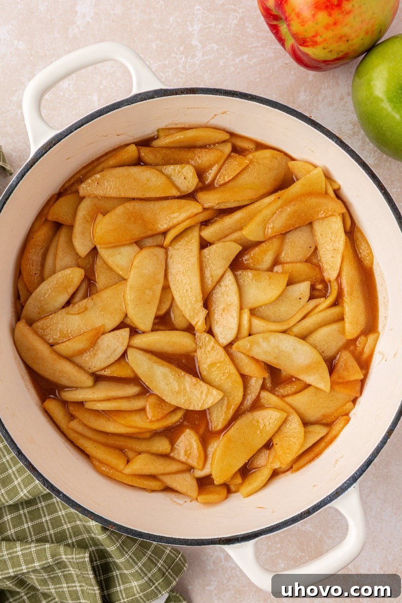 Classic Apple Pie Bars with Cinnamon Streusel 3 overhead view of partially cooked apple pie filling in a large pan