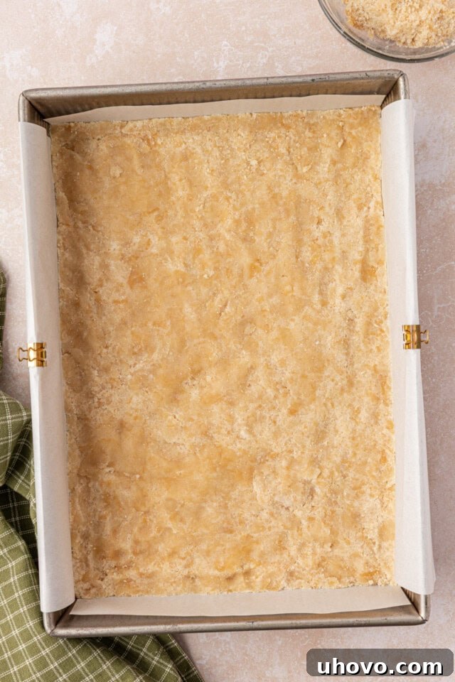Classic Apple Pie Bars with Cinnamon Streusel 6 overhead view of crust pressed into the bottom of a 9x13 pan