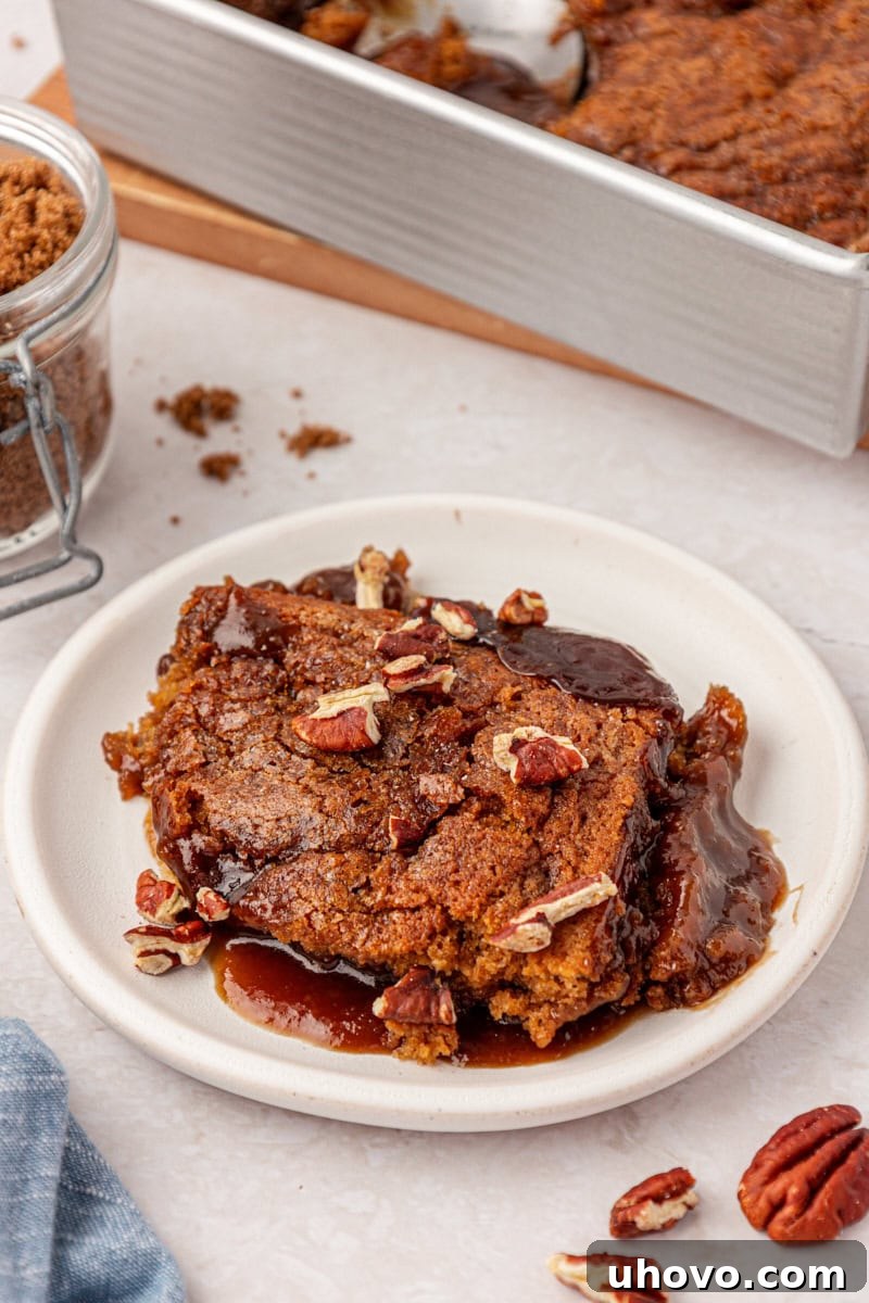 self-saucing butterscotch pudding cake scooped onto a plate
